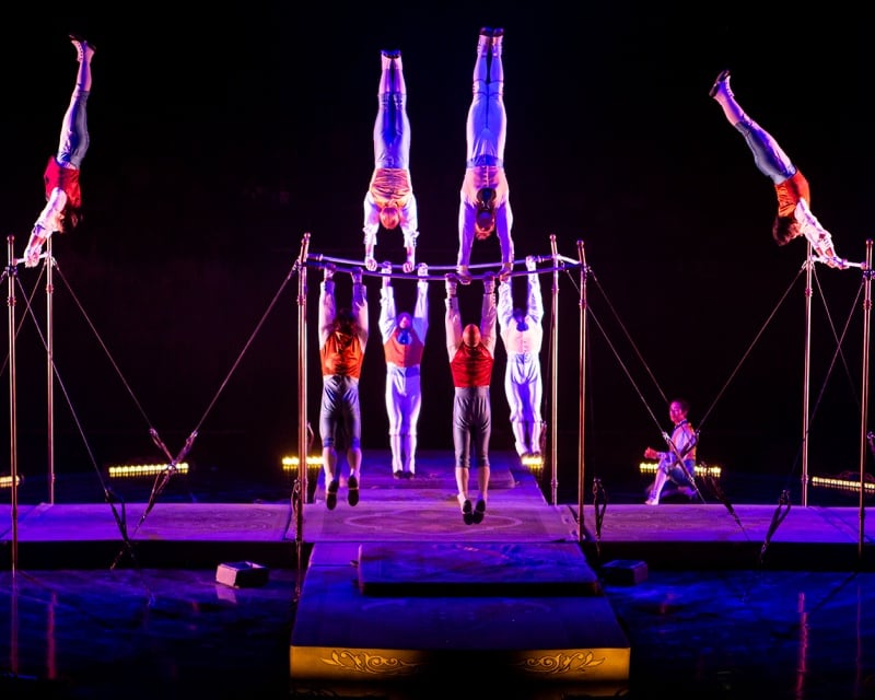 Multiple acrobats performing a tournik number.